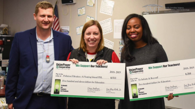 NC Electric Cooperatives presenting check to educators
